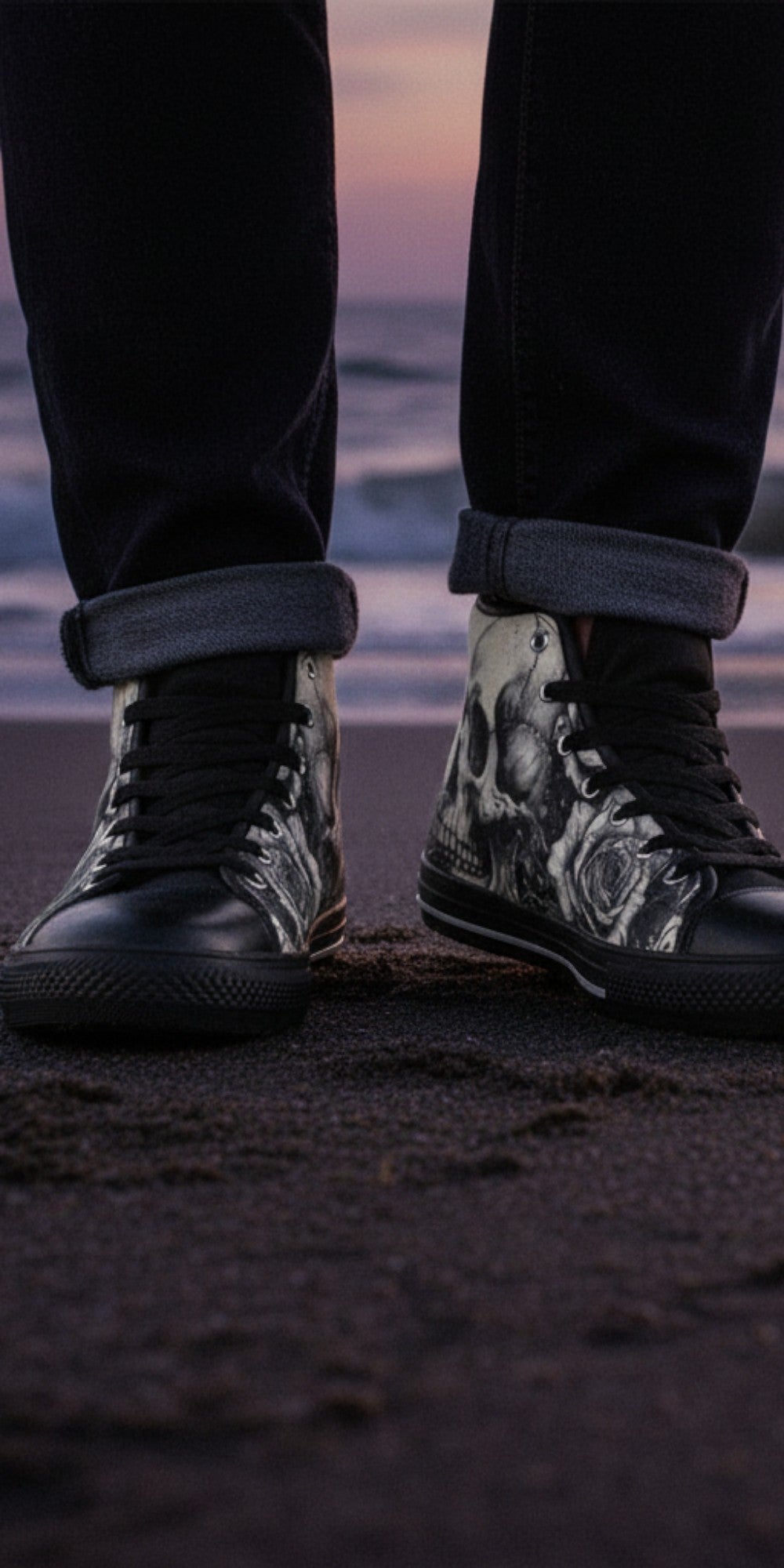 Freaky Shoes® men's high top canvas sneakers featuring a black and white skull and rose dark art print on a beach.