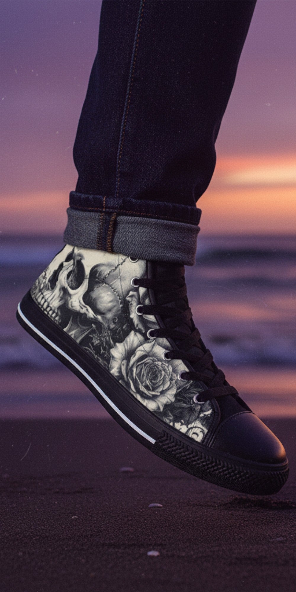 Freaky Shoes® men's high top canvas sneakers featuring a black and white skull and rose dark art print on a beach.
