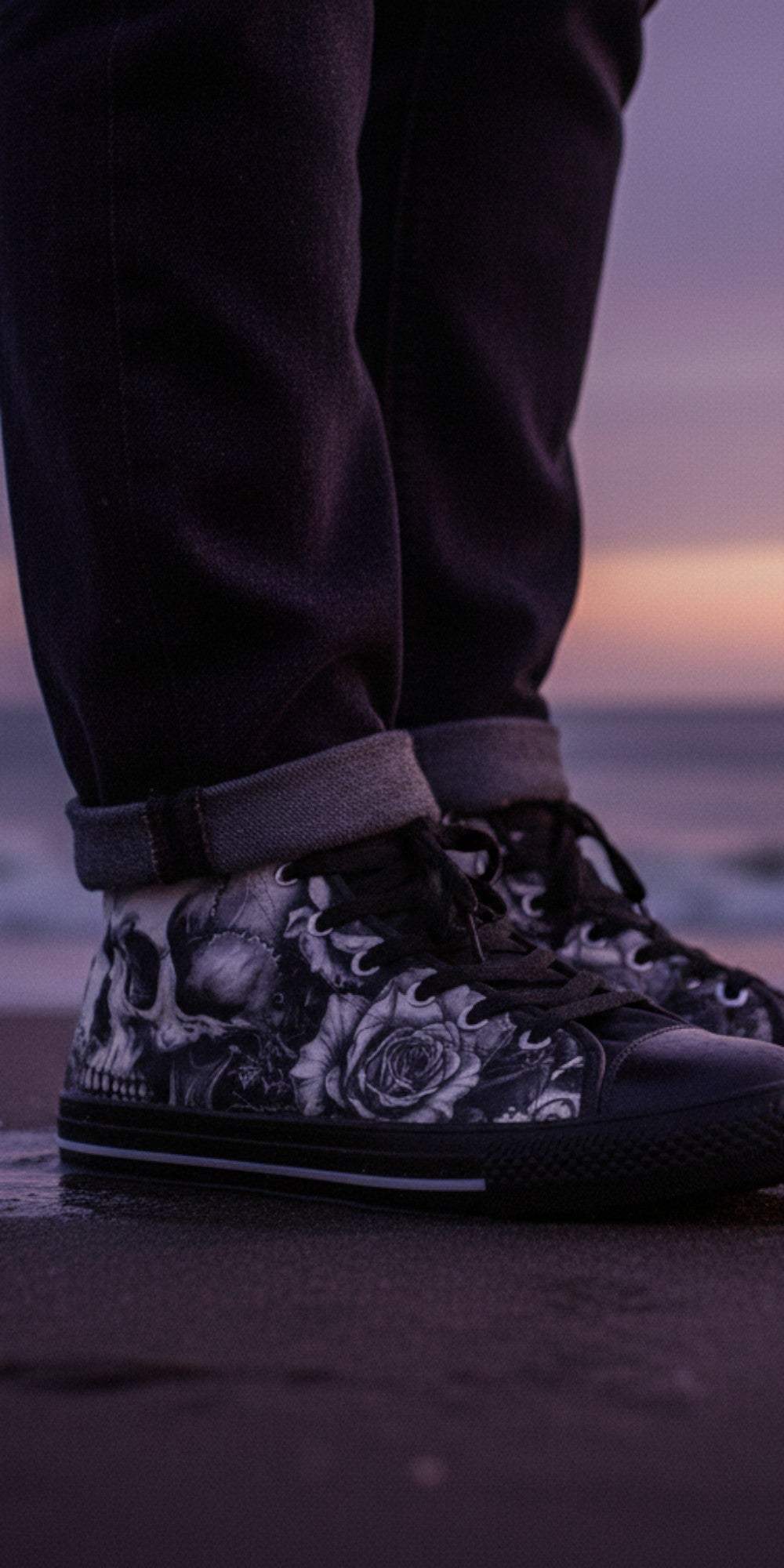 Freaky Shoes® men's high top canvas sneakers featuring a black and white skull and rose print on a beach at sunset.