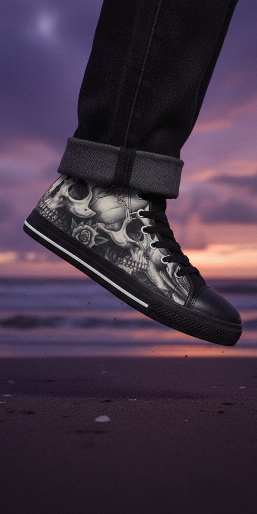 Freaky Shoes® men's high top canvas sneakers featuring a black and white skull and rose dark art print on a beach.