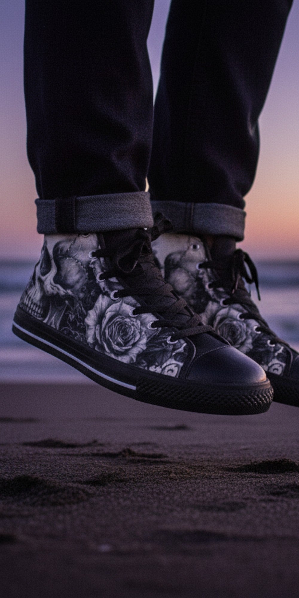 Freaky Shoes® men's high top canvas sneakers featuring a black and white skull and rose dark art print on a beach.