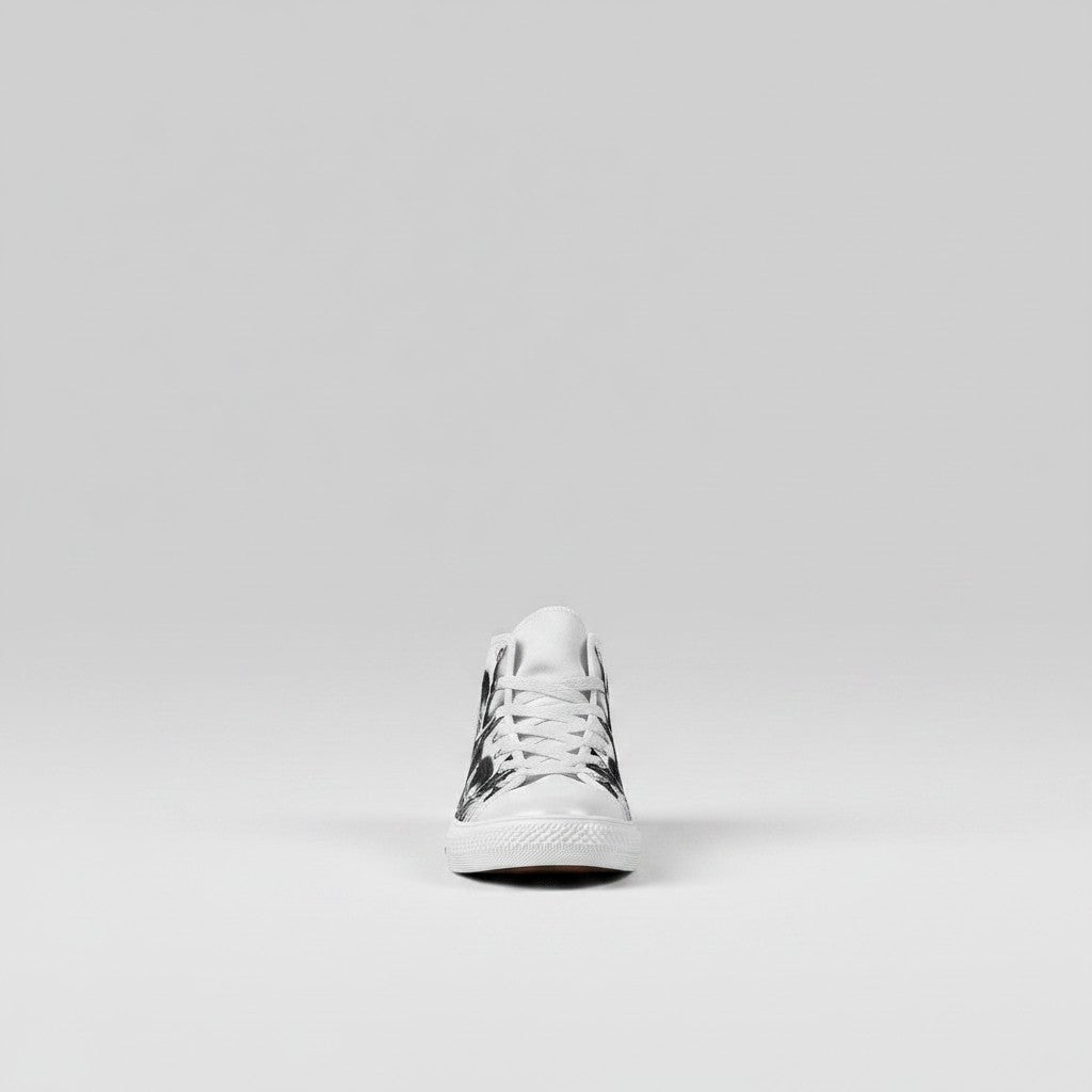 Freaky Shoes® women's high-top canvas sneakers featuring a black and white cartoon skull and rose print