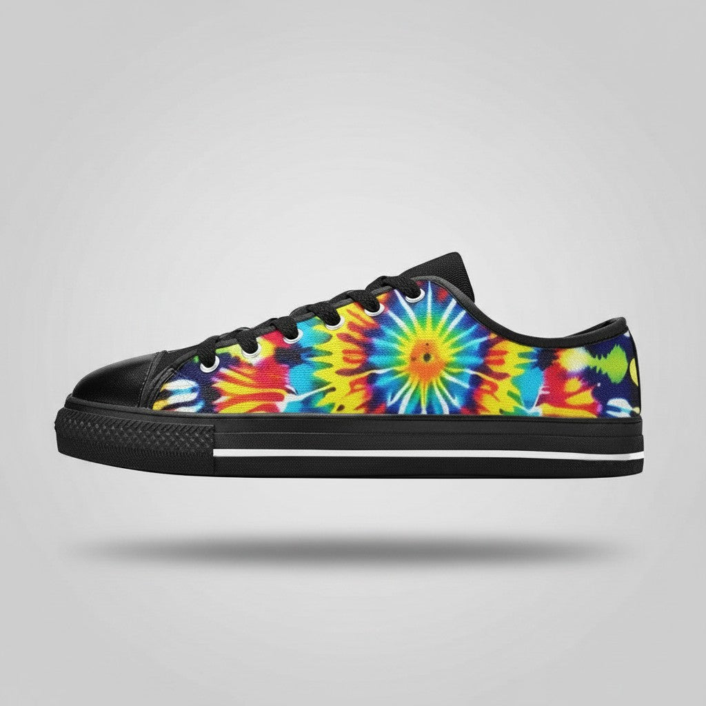 Freaky Shoes® women's low-top canvas sneakers featuring a vibrant multi-colored tie-dye sunburst pattern