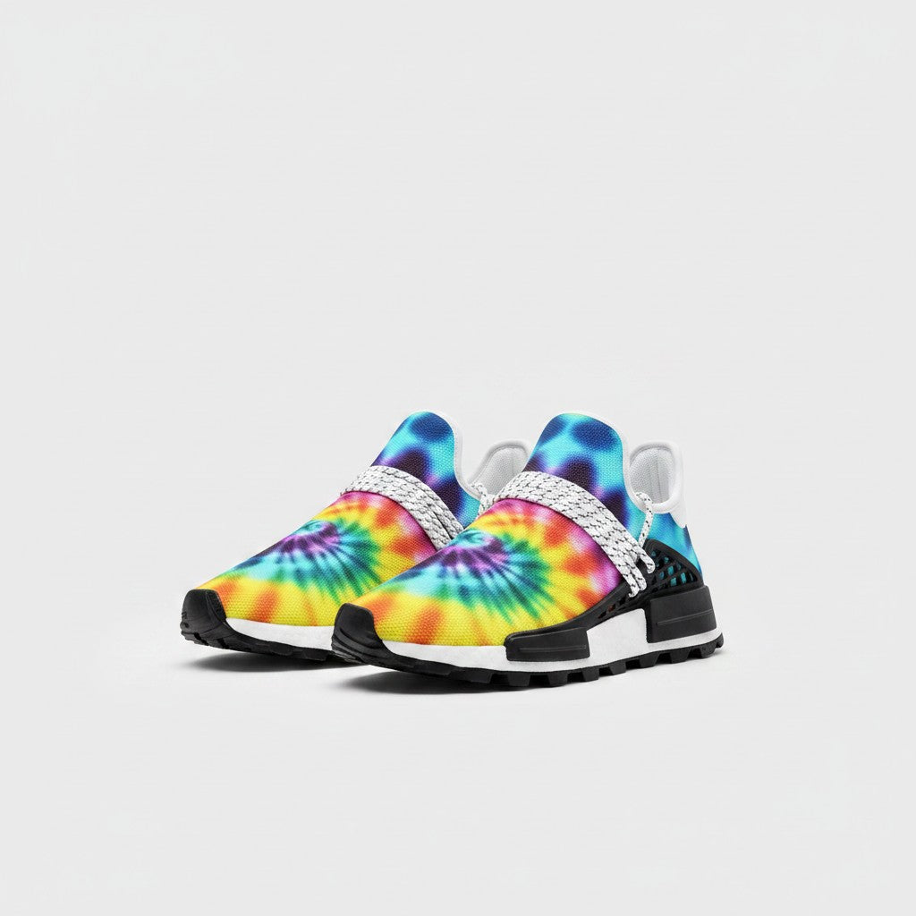 Freaky Shoes® tie dye high-top canvas sneakers with vibrant blue, yellow, and purple spiral patterns and black soles.