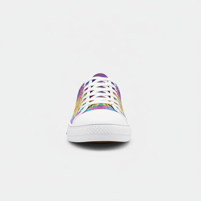 Freaky Shoes® low-top canvas sneakers featuring a vibrant, multi-coloured tie-dye shatter pattern and white toe cap.