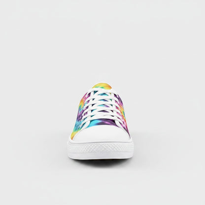 Freaky Shoes® low-top canvas sneakers featuring a vibrant multi-color tie-dye pattern and white rubber toe cap.