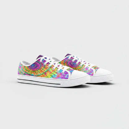 Freaky Shoes® low-top canvas sneakers featuring a vibrant, multi-colored tie-dye shatter pattern and white laces.