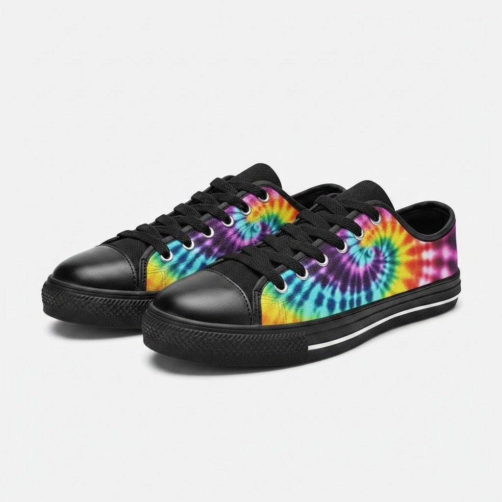 Freaky Shoes® women's low-top canvas sneakers featuring a vibrant multi-colored spiral tie-dye print and black trim.