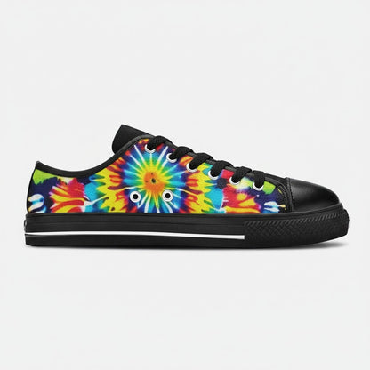 Freaky Shoes® women's low-top canvas sneakers featuring a vibrant multi-colored tie-dye pattern and black trim.