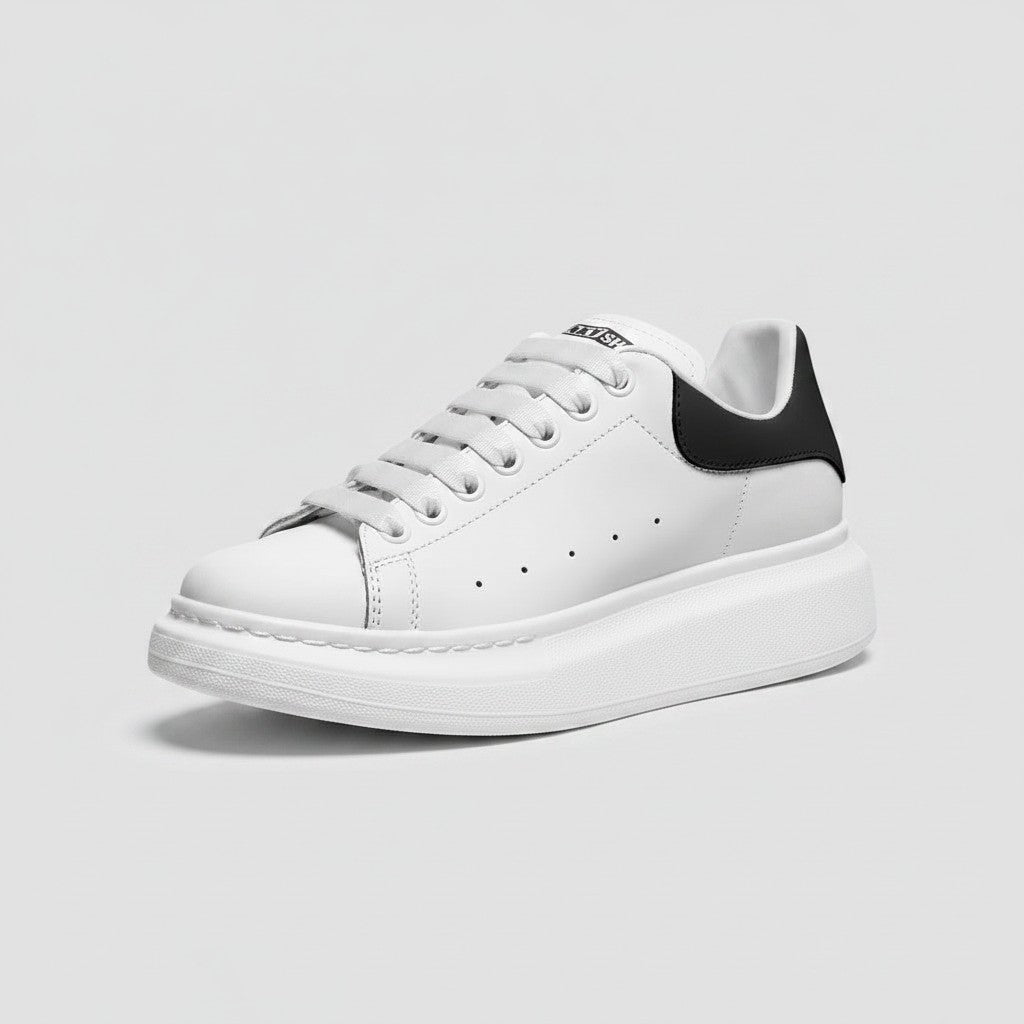 Freaky Shoes® white faux leather lace-up sneakers with a black heel tab and thick white platform sole.