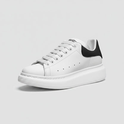 Freaky Shoes® white faux leather lace-up sneakers with a black heel tab and thick white platform sole.