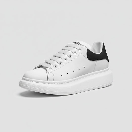 Freaky Shoes® white faux leather lace-up sneakers with a black heel tab and thick white platform sole.