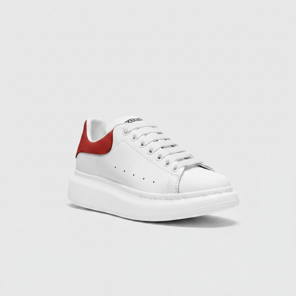 Freaky Shoes® white faux leather lace-up sneakers with a red heel tab and thick white platform sole.
