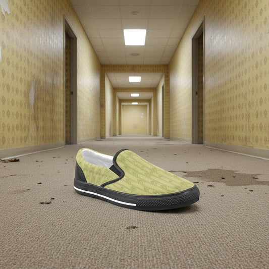 Freaky Shoes® women's light yellow canvas slip-on sneakers with black trim and a subtle geometric pattern. Features a rubber sole.